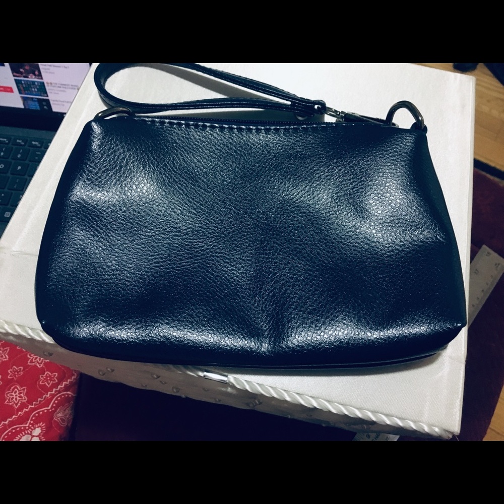 Navy blue leather wristlet with gunmetal clip